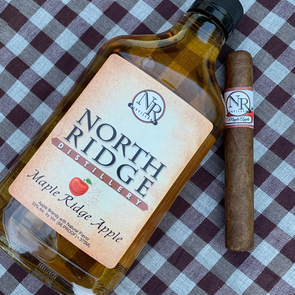 Maple Ridge Apple brandy and a hand-rolled cigar made by North Ridge Distillery in Medina, NY.